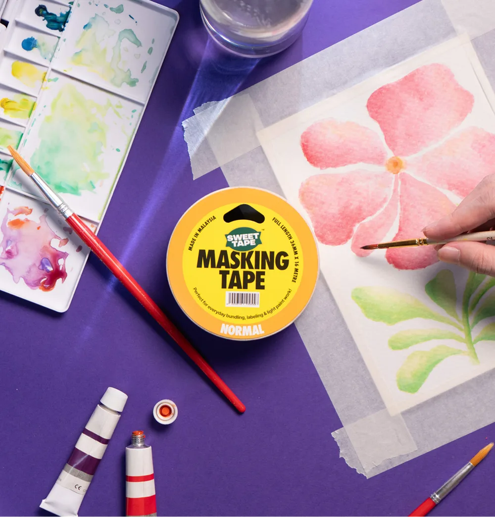 A roll of SweetTape masking tape on a watercolour painting in progress